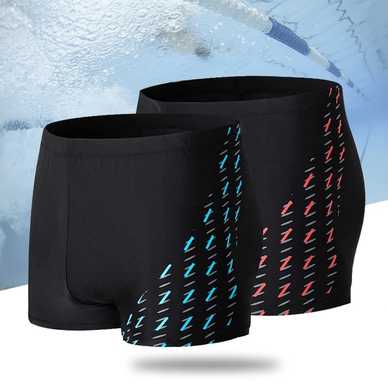 Quick dry men's swim trunks with vibrant print, showcasing stylish blue and red patterns. Ideal for beach or pool activities.
